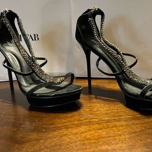 New never worn  4-5 inch heels has some minor damage to toe